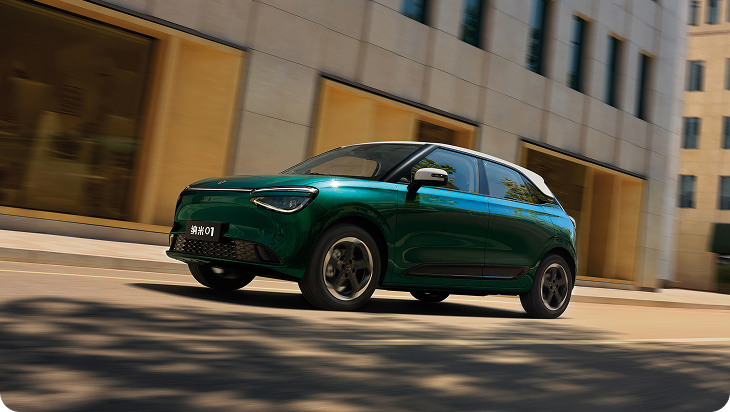 Green car in motion